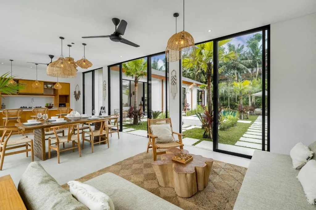 Villa Bahagia open living room with rattan furniture and garden view